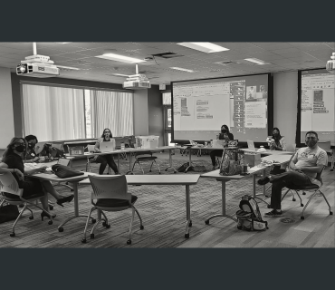 Administrators sitting in a circle at an office setting